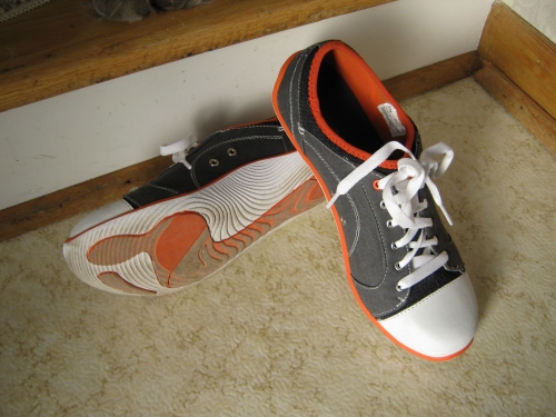 orange soles of Natural Sport sneakers