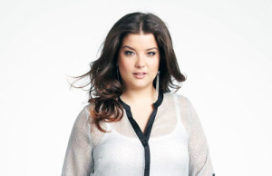 This plus size mint top with black accent strip and roll-up sleeves is from Addition-Elle.